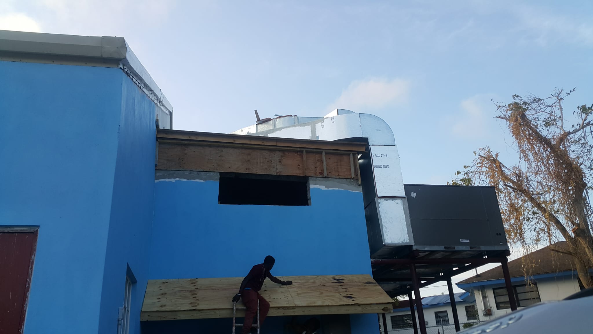 Exterior refurbishment of a blue building