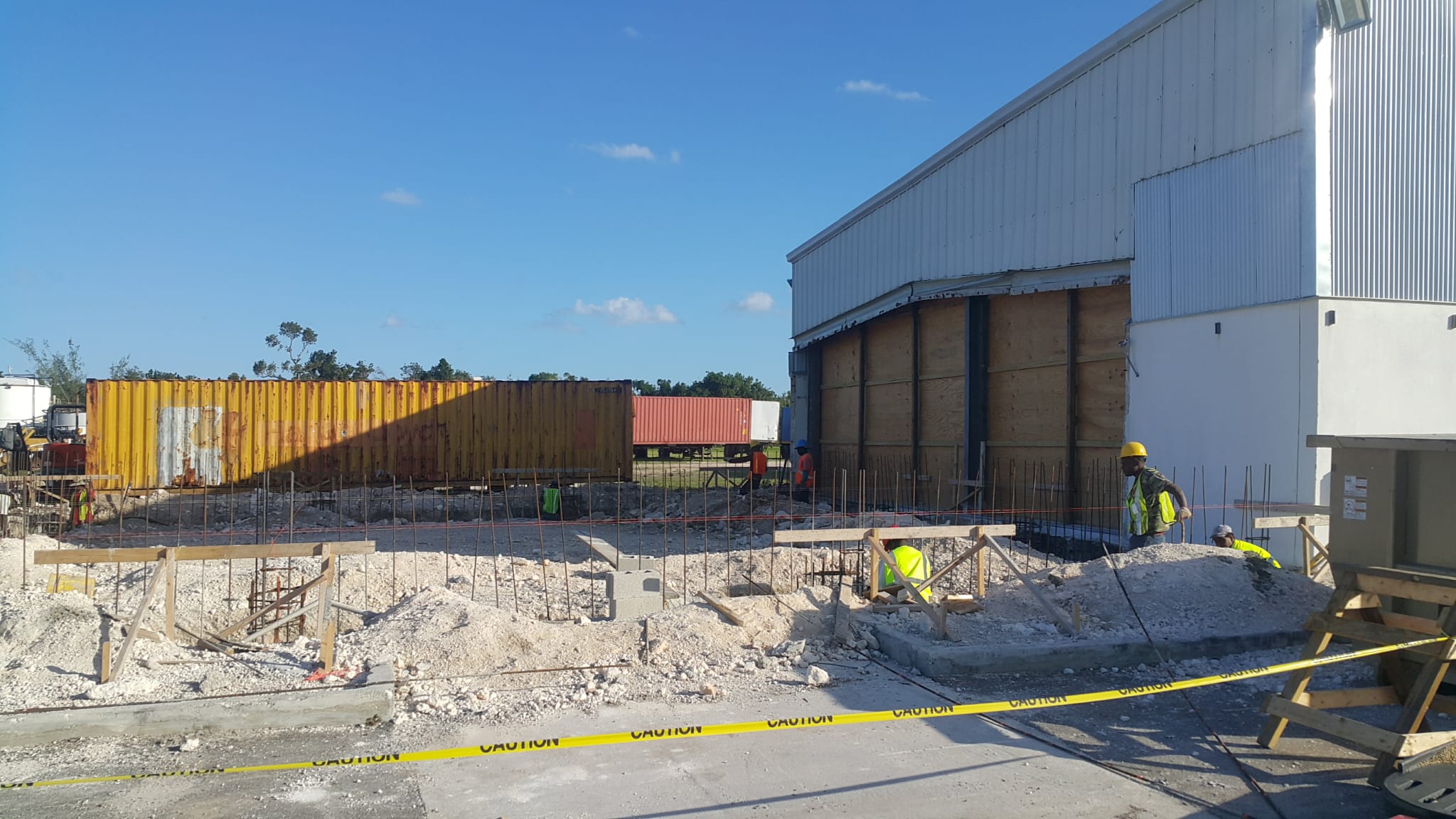 Construction work beside a commercial building